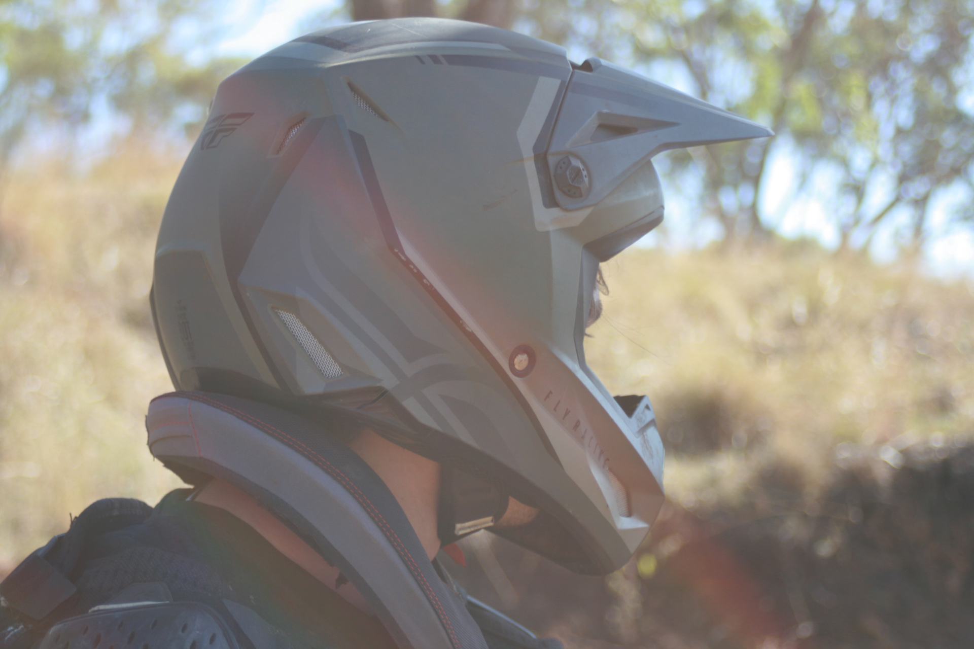 Close-up detail of a motocross helmet in the paddock